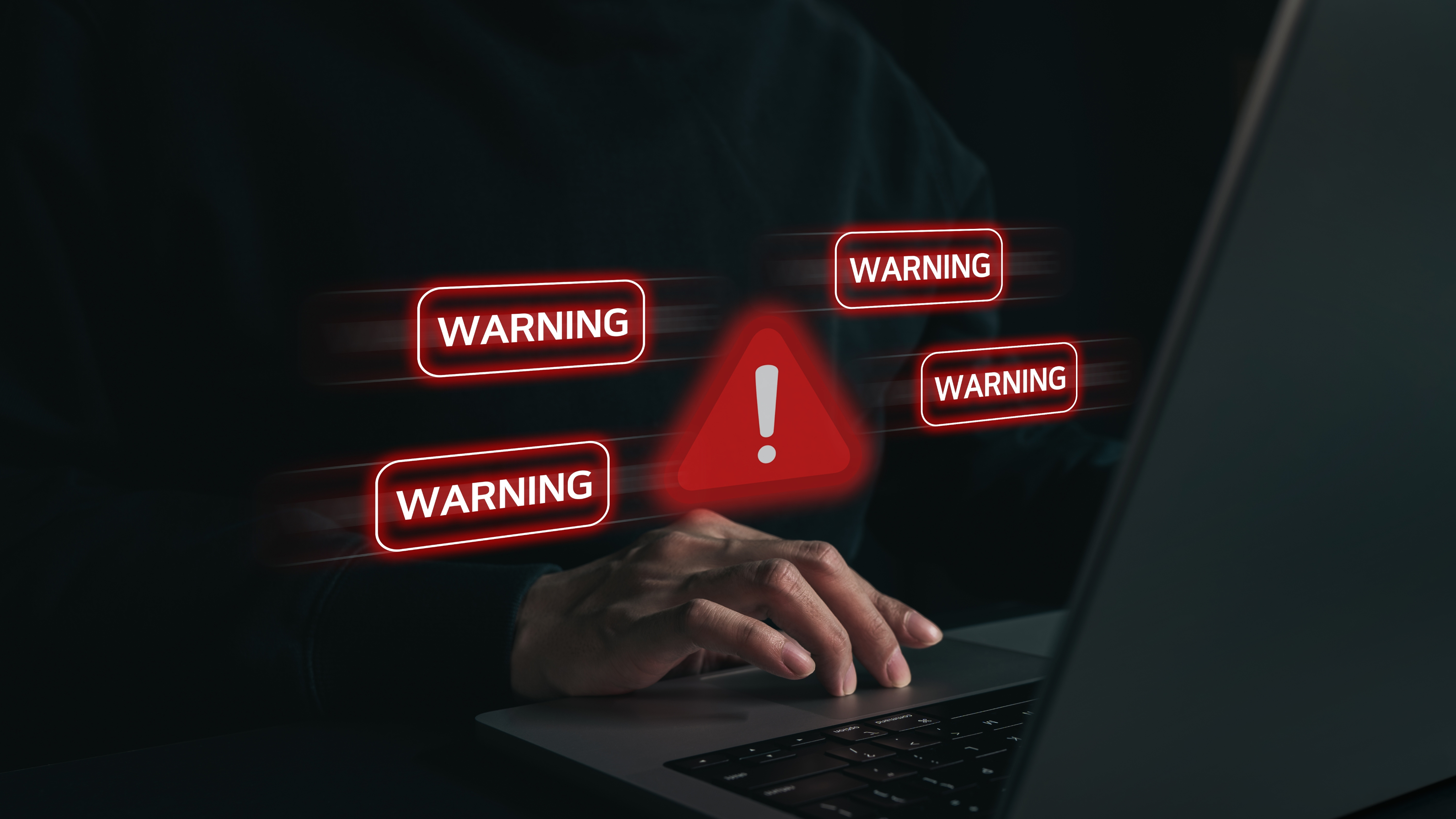 Online fraud warning shown on a laptop